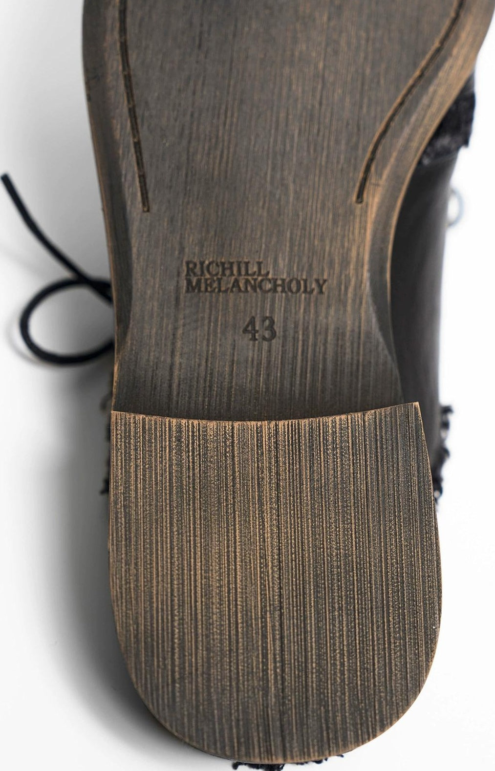SCULPTED LEATHER HALF SLIP-ONS